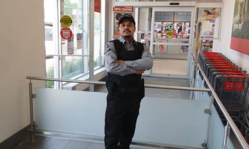 Nicagon security guard on static guard duty inside a retail store