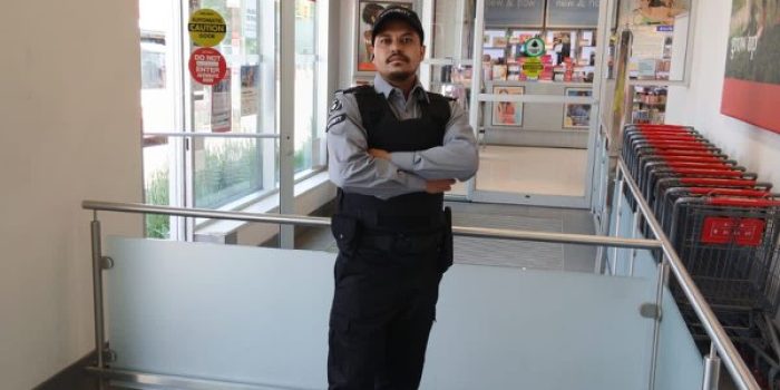 Nicagon security guard on static guard duty inside a retail store